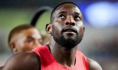 Cameroonian sprinter Emmanuel Eseme wearing a red Cameroon jersey with his race bib at the 2026 Commonwealth Games in Glasgow.