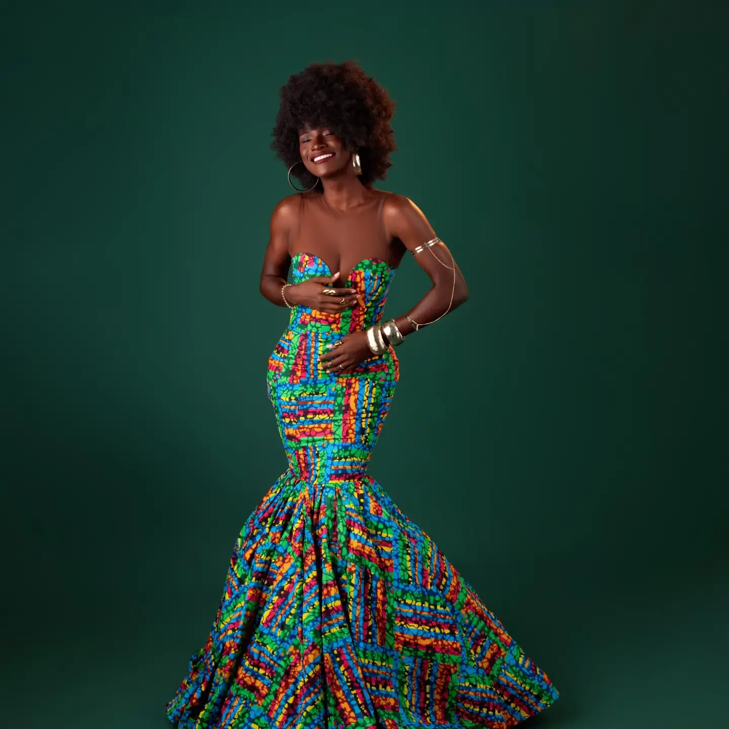 BBNaija Season 11 Week 4 Head of House Abi Ayoola in a colourful strapless Ankara floor-length gown with an afro hairstyle