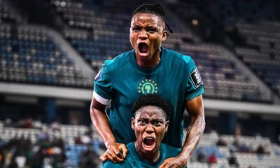 Asisat Oshoala shouting in celebration with a Super Falcons teammate after scoring Nigeria's winning goal against Zambia at WAFCON 2026.