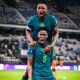 Asisat Oshoala shouting in celebration with a Super Falcons teammate after scoring Nigeria's winning goal against Zambia at WAFCON 2026.