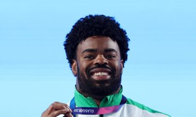 Chukwuebuka Enekwechi holding his gold medal and official mascot at the 2026 Commonwealth Games in Glasgow.