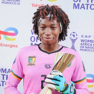 Michaely Bihina holding her TotalEnergies Woman of the Match award after Cameroon defeated Nigeria 1-0 in the WAFCON quarter-finals.