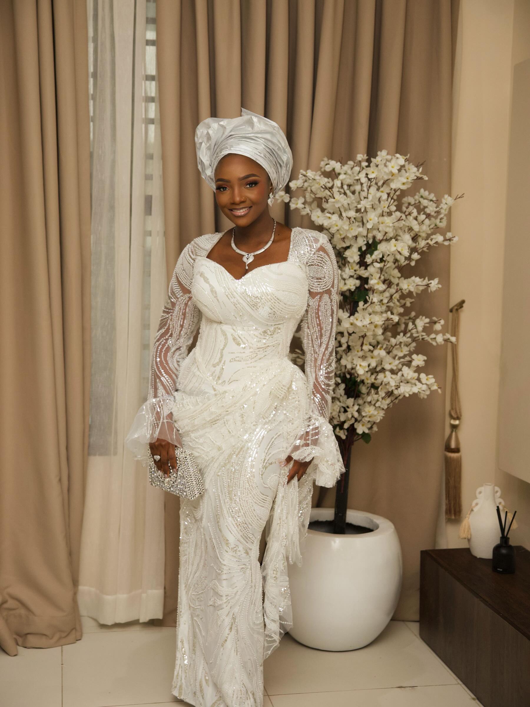 Simi & Adekunle Gold Celebrate Their Son Adeifemi’s Dedication in Elegant All-White Style | See Photos