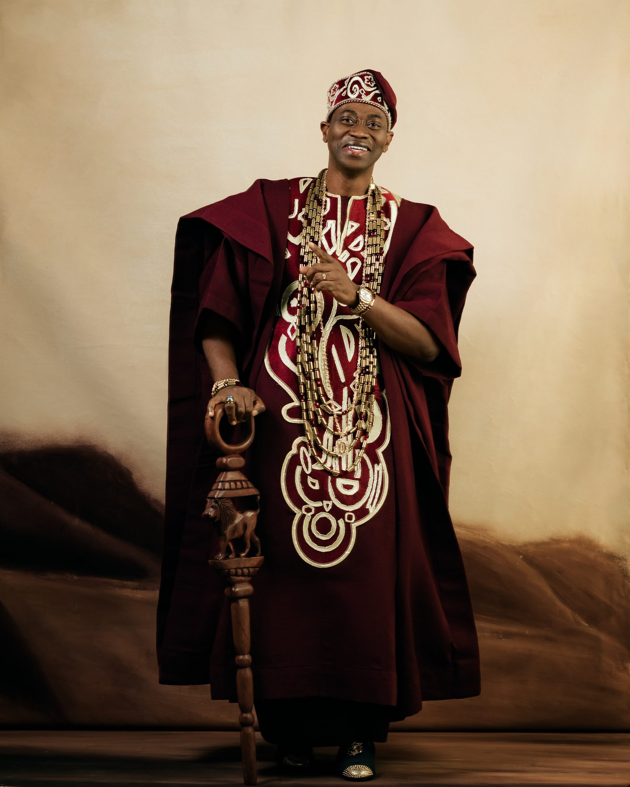 Lateef Adedimeji’s Wine Agbada Look Is Everything We Love About Nigerian Menswear