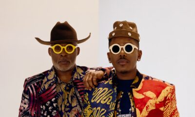 RMD and Timini Egbuson posing shoulder-to-shoulder in high-fashion custom adire menswear styled by Zackstyling Luxury.