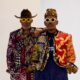 RMD and Timini Egbuson posing shoulder-to-shoulder in high-fashion custom adire menswear styled by Zackstyling Luxury.