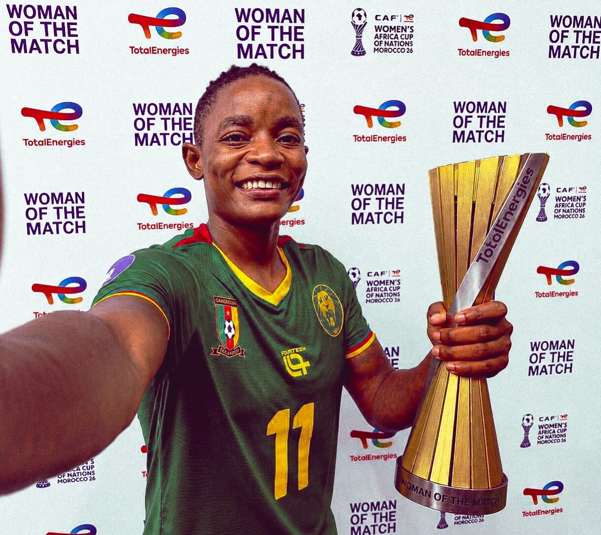 Marie Ngah taking a selfie with her Woman of the Match trophy after the WAFCON 2026 final.