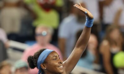 Coco Gauff smiling and waving to the crowd following her Cincinnati Open semi-final victory.