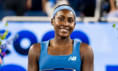 Coco Gauff smiling while holding the Rookwood Cup after winning the 2026 Cincinnati Open.