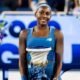 Coco Gauff smiling while holding the Rookwood Cup after winning the 2026 Cincinnati Open.