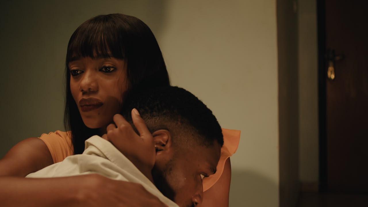 Onyinye Odokoro embracing Tobi Bakre in a emotional scene from Before We Fall Asleep.