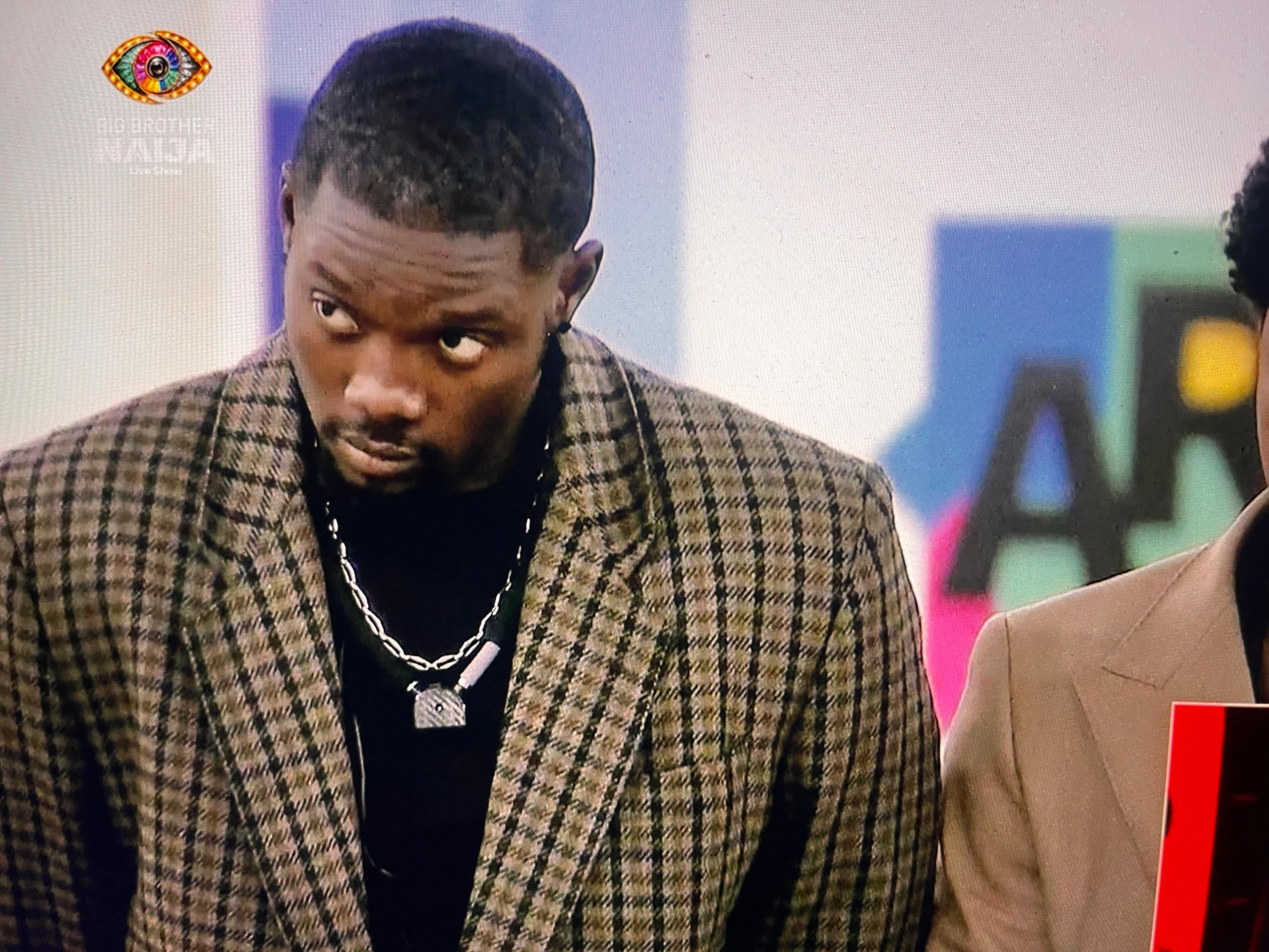 BBNaija Season 11 housemate Yusuf standing while awaiting eviction results from Ebuka Obi-Uchendu