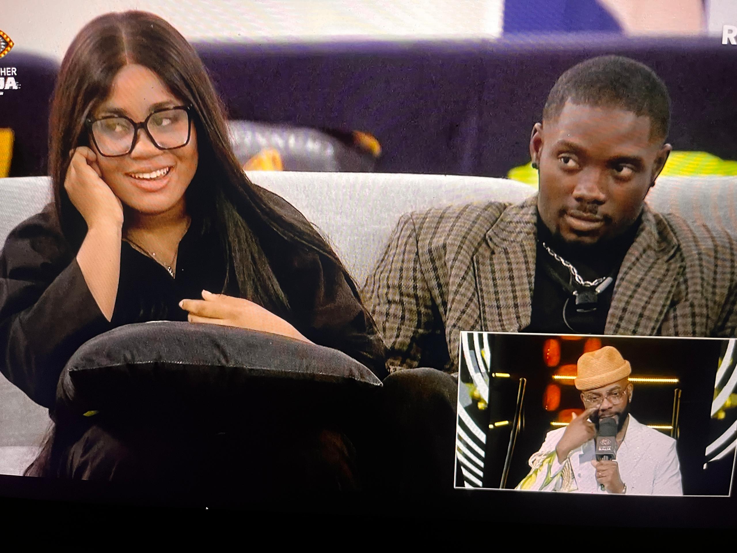 BBNaija Season 11 housemates Bells and Yusuf seated on the couch during the live show.
