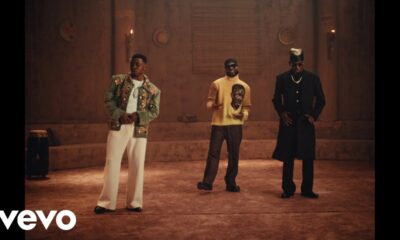 Davido, Mayorkun, and FOLA performing together inside a clay palace setting for the B4 B4 music video.