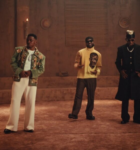 Davido, Mayorkun, and FOLA performing together inside a clay palace setting for the B4 B4 music video.