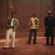 Davido, Mayorkun, and FOLA performing together inside a clay palace setting for the B4 B4 music video.