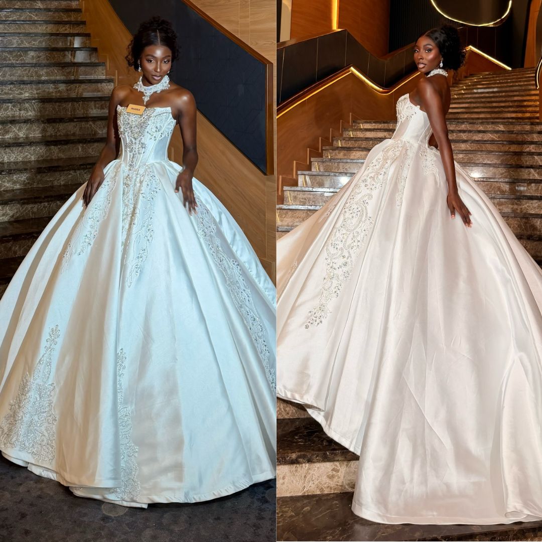 Tamunosoye Karibi-George in a white satin ballgown with crystal embellishments and choker collar at Miss World 2026 Top Model Stage