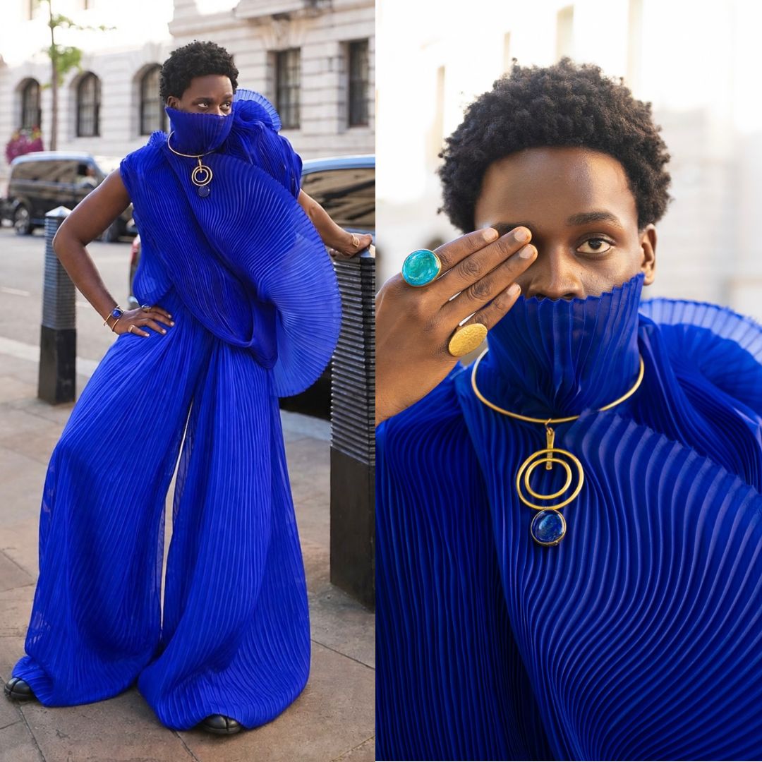 Tobe wearing an LFJ royal blue pleated set with ultra-wide trousers and a high collar