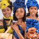 three Miss Guiné-Bissau UK 2026 contestants styled in traditional headwraps and cultural accessories
