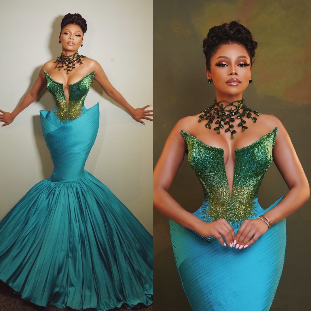 Bonang Matheba wearing a forest green and teal Veekee James couture gown at the Miss South Africa 2024 grand finale.