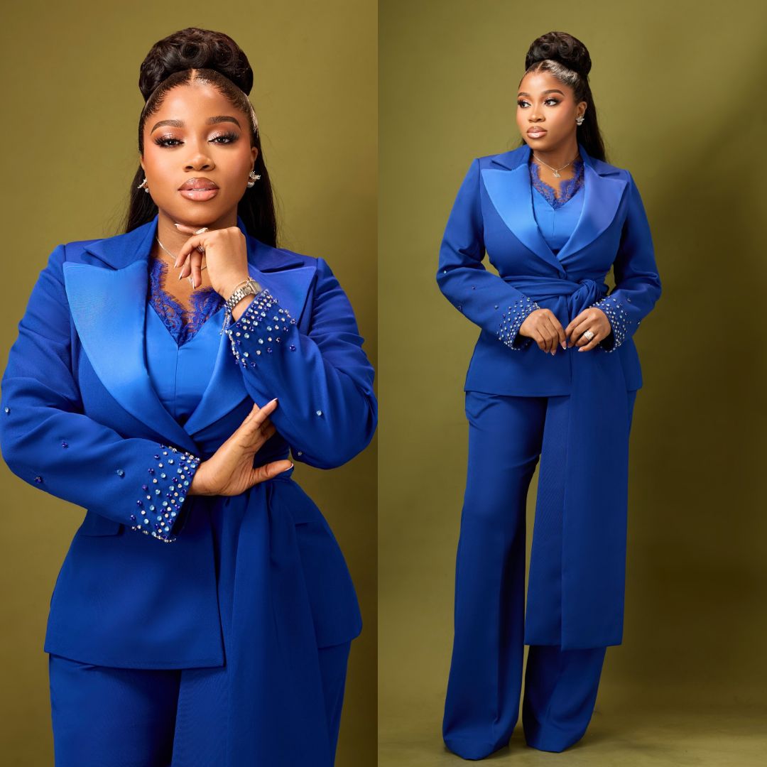 Veekee James wearing a royal blue suit with satin lapels and wide-leg trousers