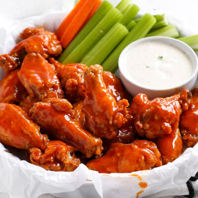 Crispy buffalo chicken wings tossed in hot sauce served with ranch dip, celery sticks, and sliced carrots.