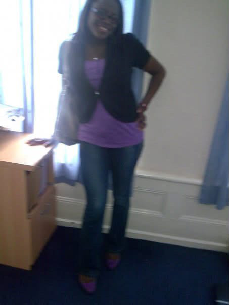 Former BellaNaija columnist Mrs Kush in a purple top, black cardigan, and jeans during her early blogging days.
