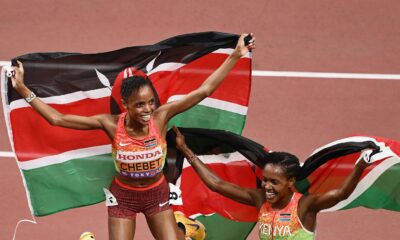 Kenyan long-distance runners Beatrice Chebet and Faith Kipyegon jumping with Kenyan flags at the World Athletics Championships Tokyo 25