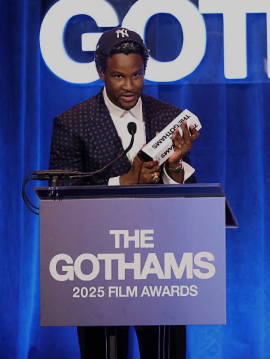Director Akinola Davies Jr. accepting the Breakthrough Director award at podium during the Gotham Film Awards.