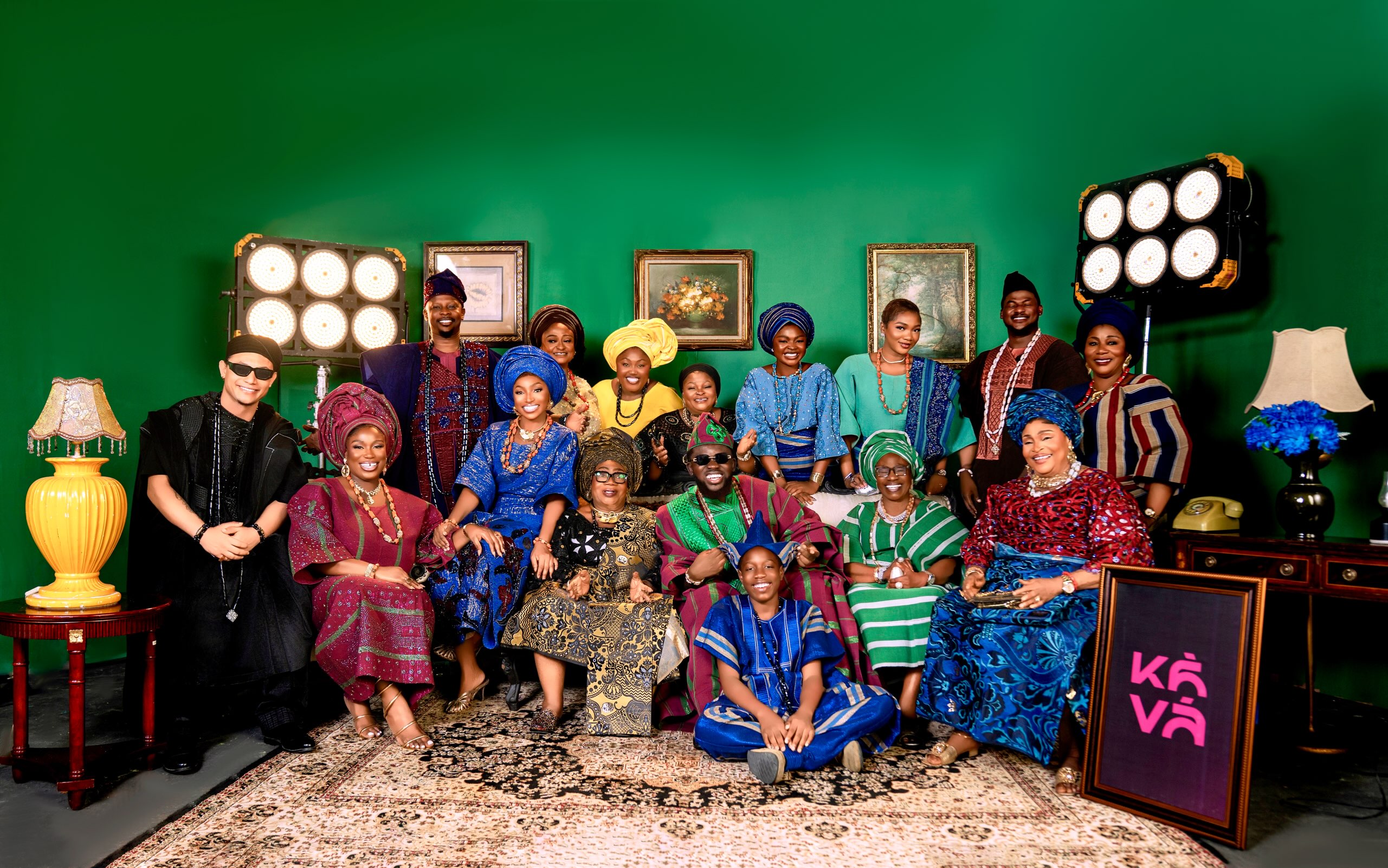 Ensemble cast of A Mama Deola Wedding Story wearing traditional Nigerian lace and Aso Oke outfits
