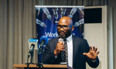 Professor Obi Davies-Ekwenna speaking at podium during Redeemer’s Health Village Robotics Surgery Launch Dinner following West Africa’s first tele-robotic surgery.