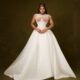 Veekee James in a full white basque-waist ballgown with an embellished corset