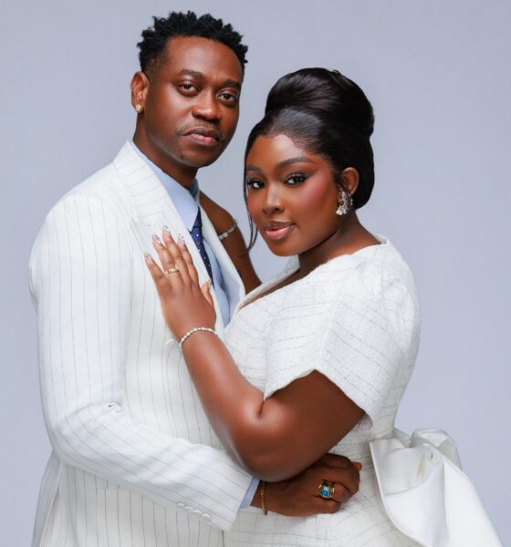 Mo Bimpe showcasing a high beehive updo and glam makeup next to Lateef Adedimeji