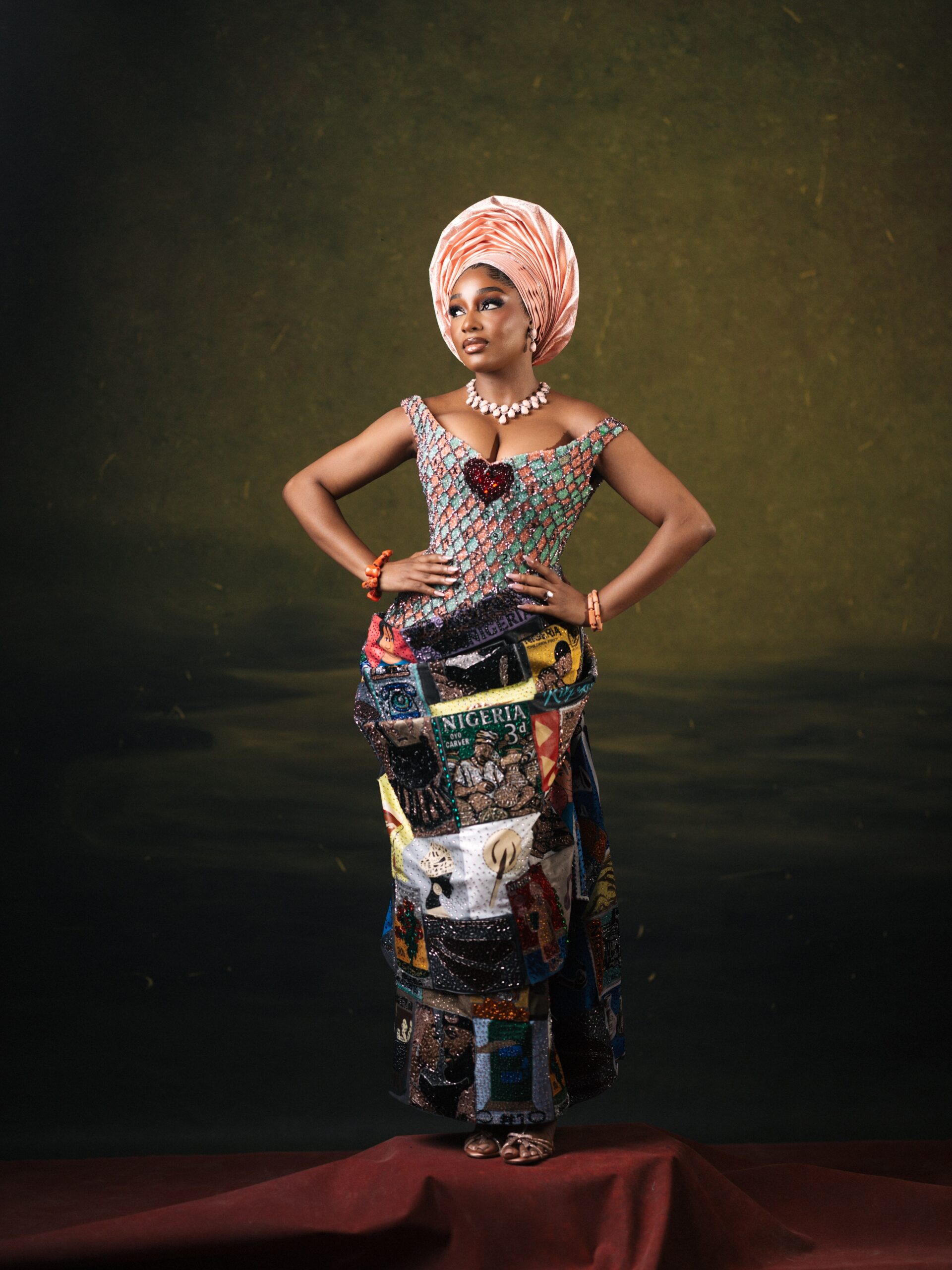 Kiky Festus in a Prudential sweetheart top and custom wrapper constructed from vintage Nigerian postage stamp prints.