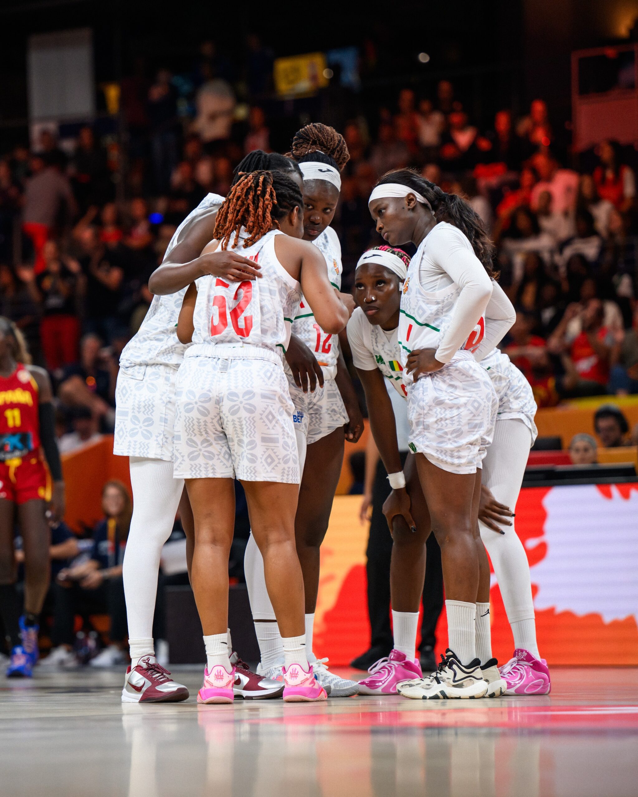 Mali women’s basketball team in a tactical huddle during their FIBA World Cup 2026 match against Spain in Berlin.