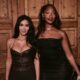 Tems in a black strapless dress posing beside Kim Kardashian in a brown leather corset dress at the SKIMS London event.