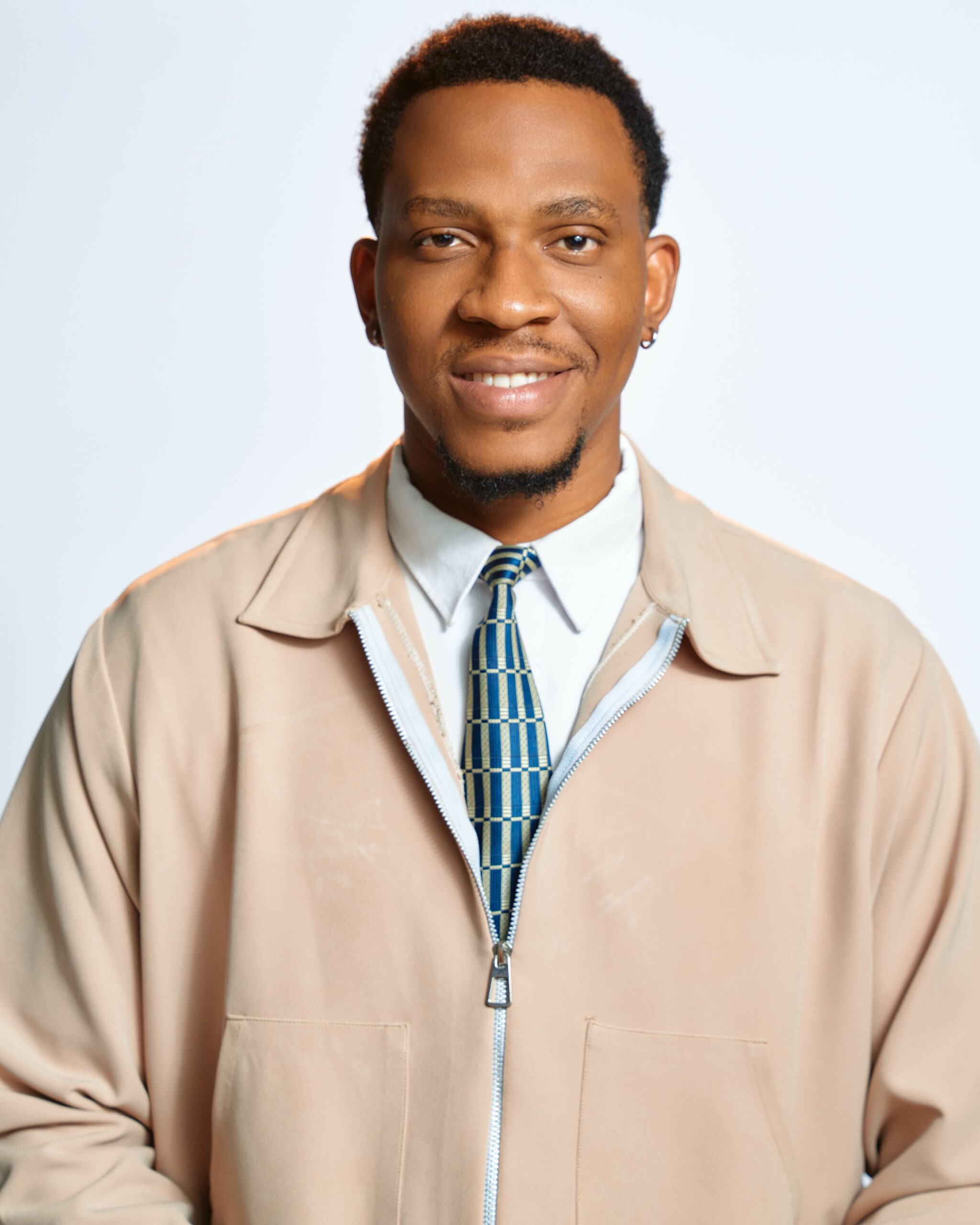 BBNaija Season 11 Ultimate Veto Power holder Barry wearing a beige jacket and patterned tie