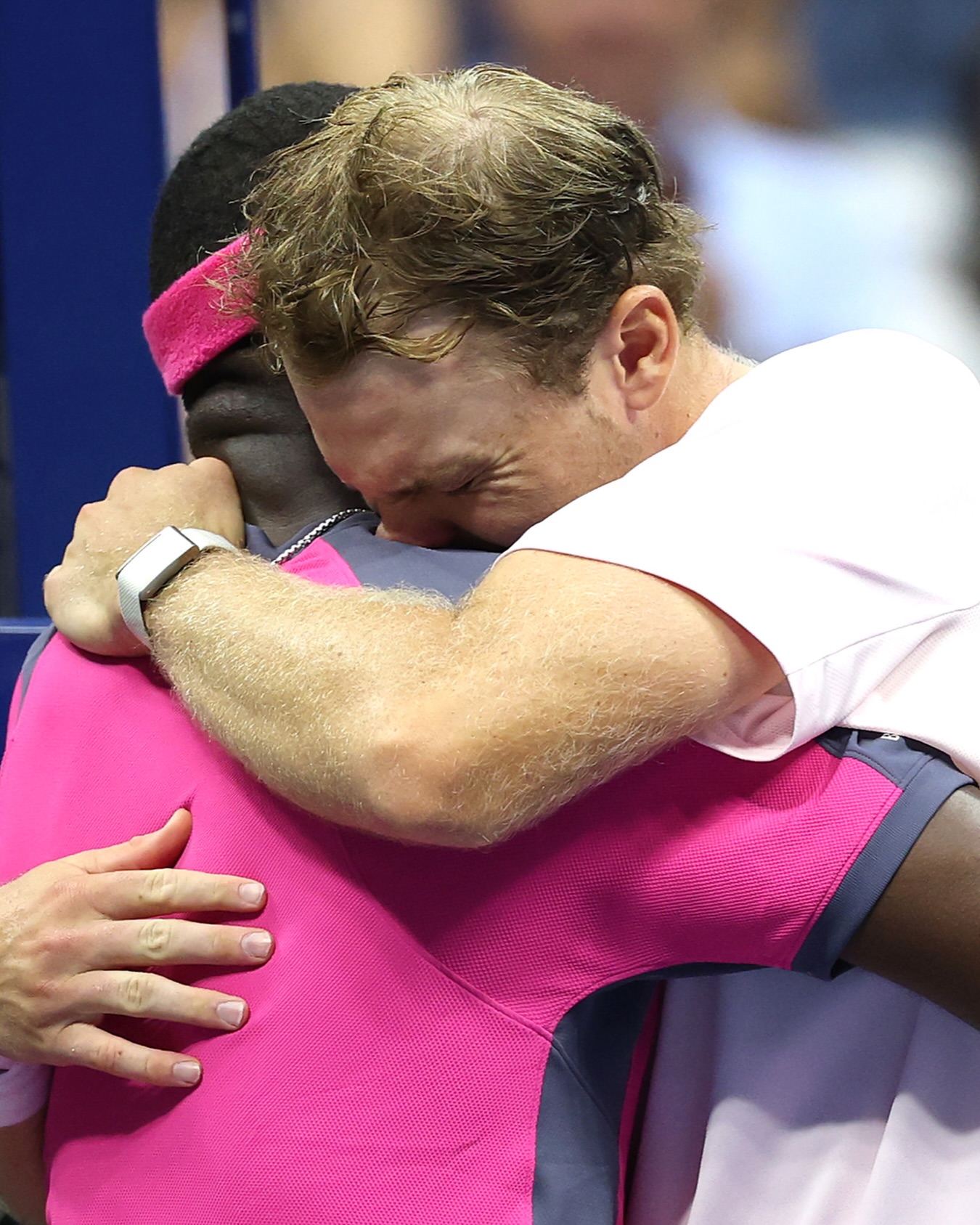 Frances Tiafoe embracing a tearful Alex Michelsen at the net after their five-set match.