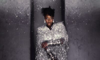 Ayra Starr in a shimmering silver tinsel cape dress with drop earrings, photographed by Fernando Tomaz for 66 GREENE Magazine.