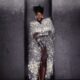 Ayra Starr in a shimmering silver tinsel cape dress with drop earrings, photographed by Fernando Tomaz for 66 GREENE Magazine.