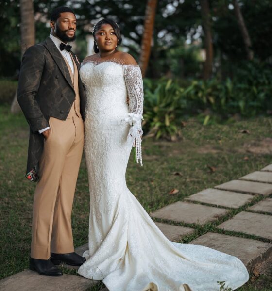 Nollywood actor Stan Nze in P.Aries tailcoat suit with wife Blessing Obasi Nzediegwu in Prudential lace wedding dress at vow renewal ceremony.