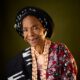 Grace Owoola 96th Birthday Portrait in Sequined Maroon Lace