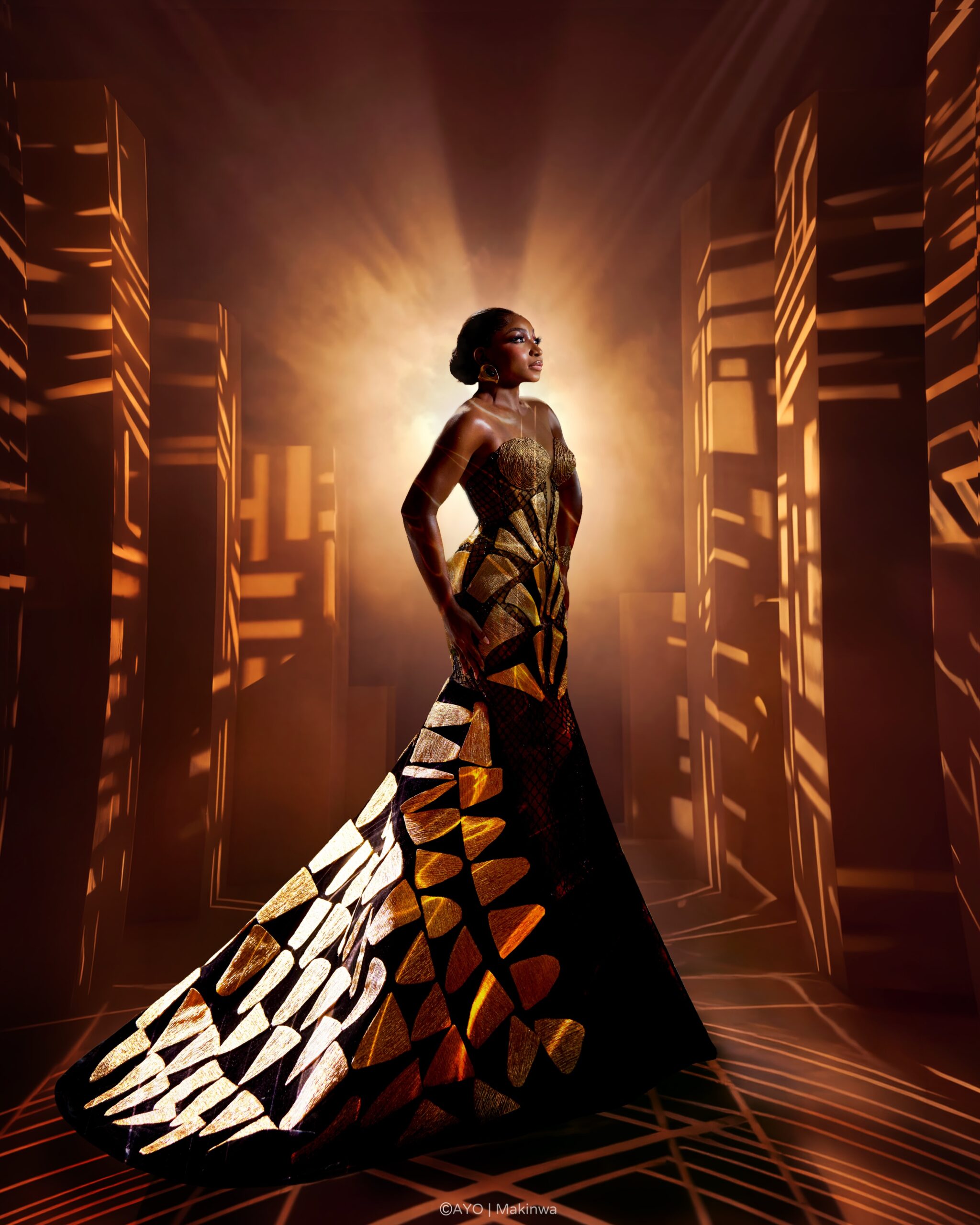 Omowunmi Dada showcasing side profile of custom Somobysomo gown at Toronto International Film Festival.