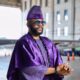 Ebuka Obi-Uchendu wearing layered black stone neck beads and a purple velvet agbada by D29 Africa.
