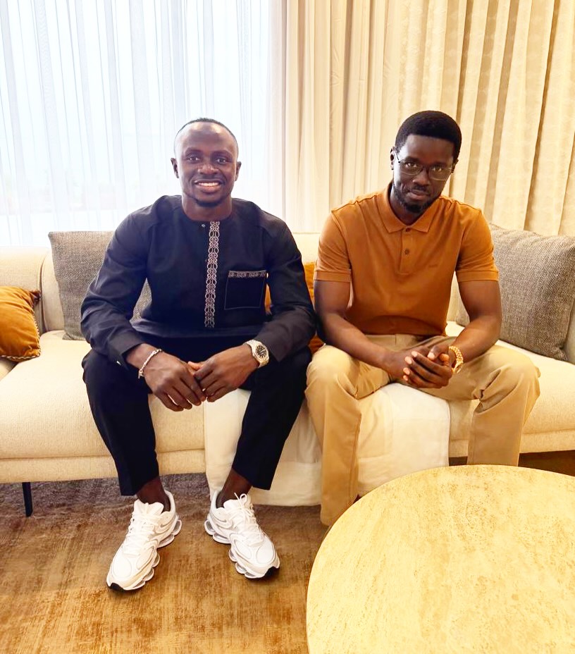 Sadio Mané sitting with Senegalese President Bassirou Diomaye Faye during an official meeting for SM10 Agro