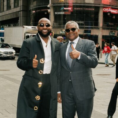Davido and Aliko Dangote standing on a New York City street during United Nations General Assembly week