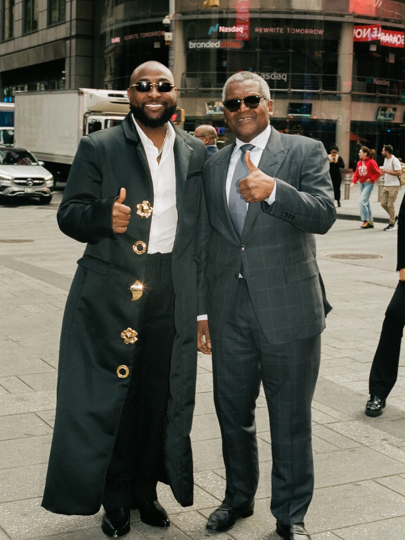 Davido and Aliko Dangote standing on a New York City street during United Nations General Assembly week