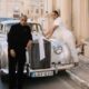 LAX leaning on a vintage silver Rolls Royce while Ella poses on the hood in her wedding dress in Malta.