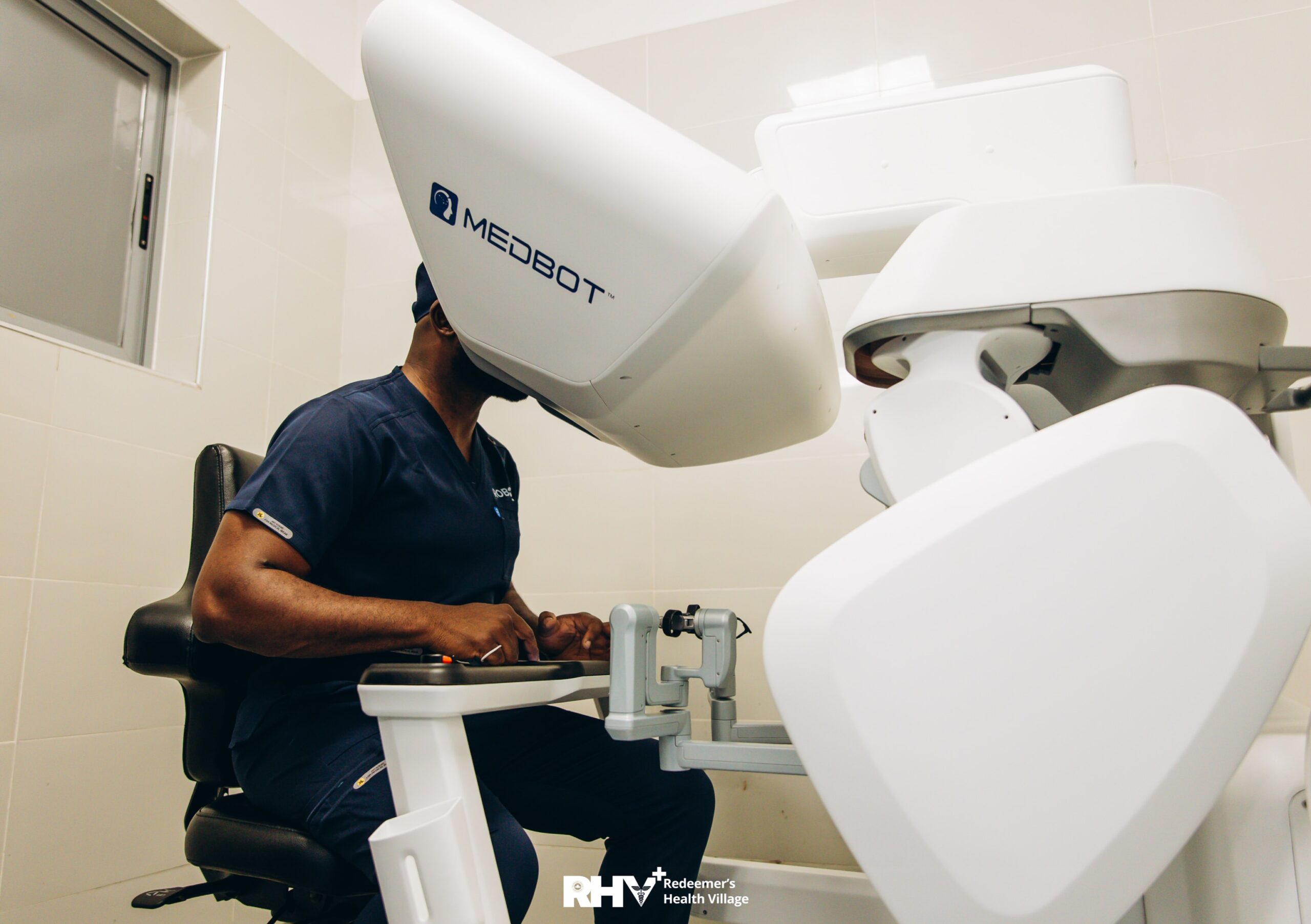 Professor Obi Davies-Ekwenna operating Toumai MedBot robotic surgical console at Redeemer’s Health Village.