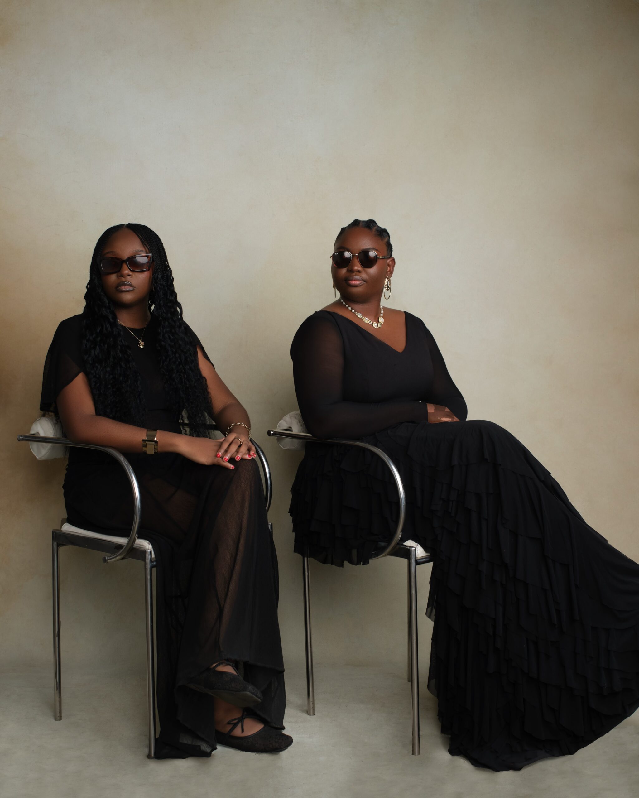 Producer Nora Awolowo and director Fatimah Binta Gimsay posing in black outfits and sunglasses